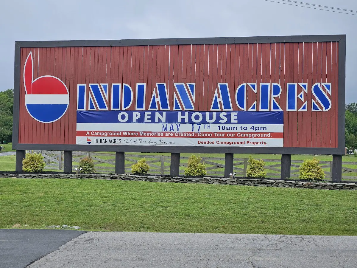 A sign for an indian acres open house.